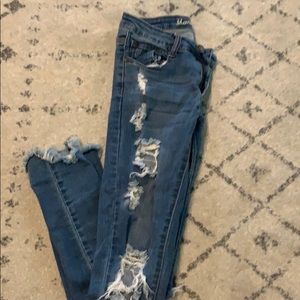 Distressed raw hem jeans